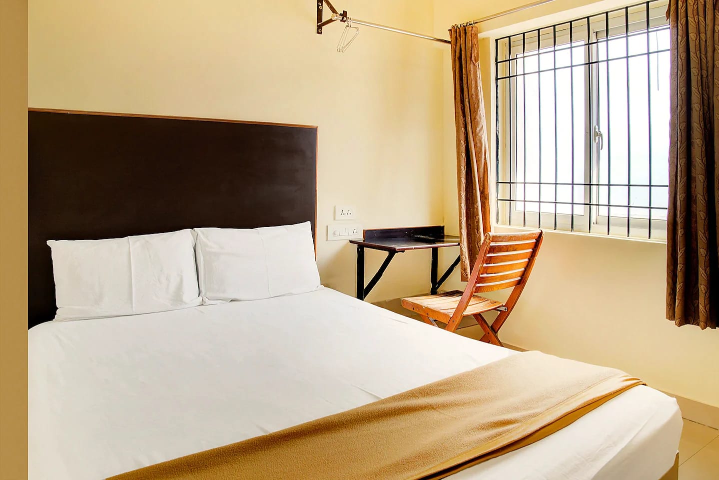 Nisarga Lodge — Deluxe AC room (representative photo)