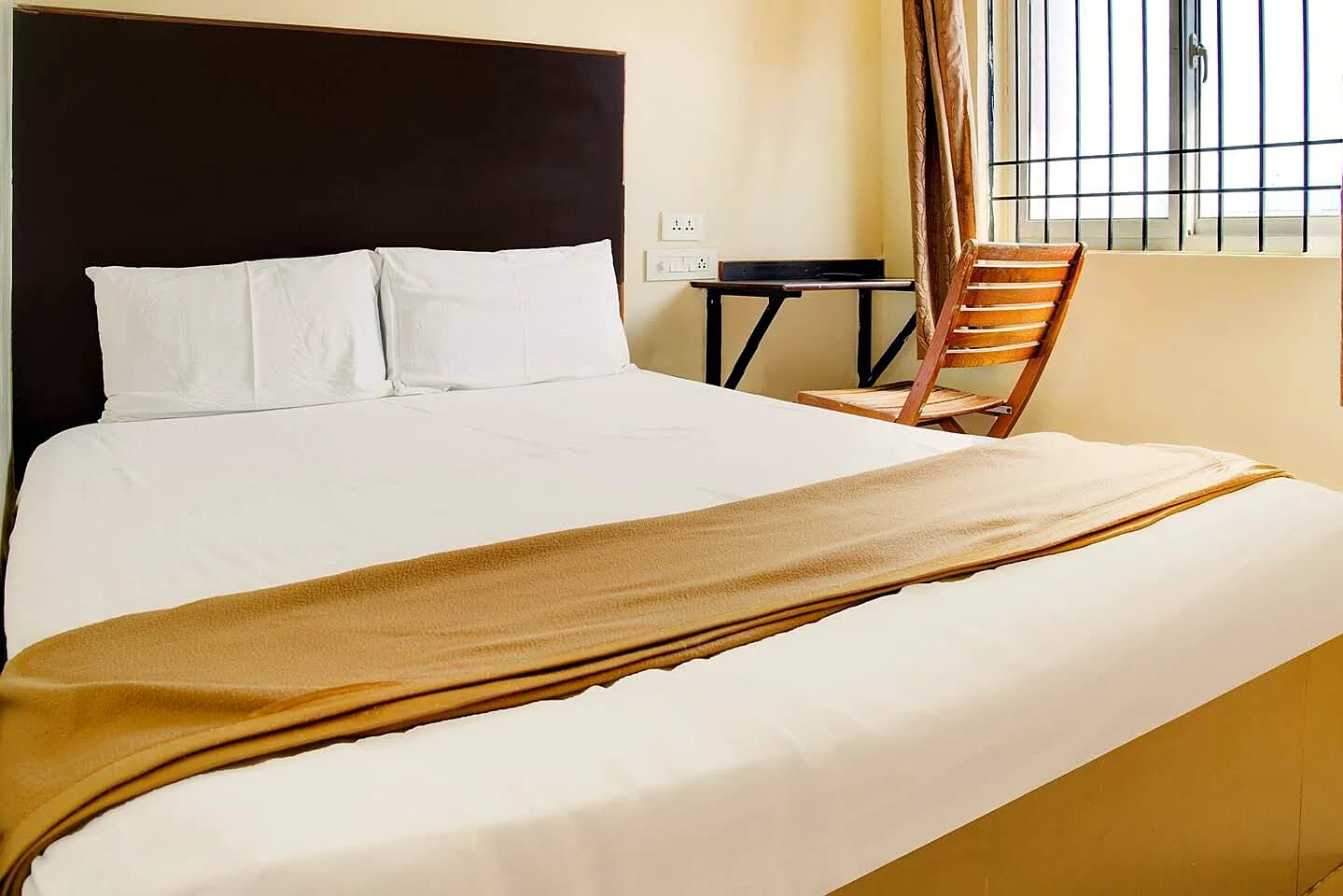 Nisarga Lodge — Deluxe AC room, double bed (representative photo)