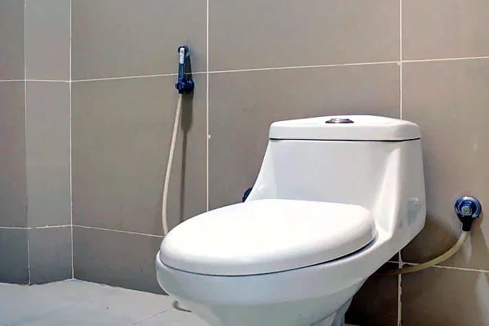 Nisarga Lodge — Attached bathroom (representative photo)
