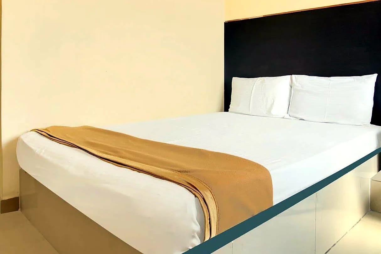 Nisarga Lodge — Deluxe AC room (representative photo)