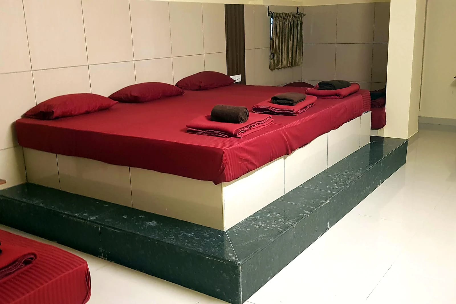 Nisarga Lodge — Multi-bed room (representative photo)