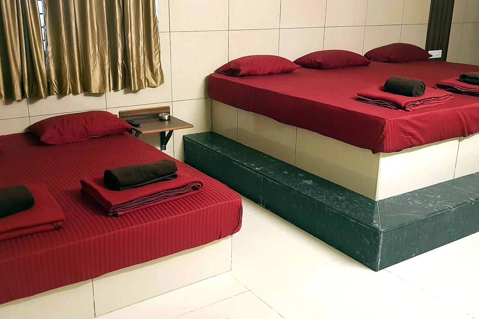 Nisarga Lodge — Multi-bed room (representative photo)